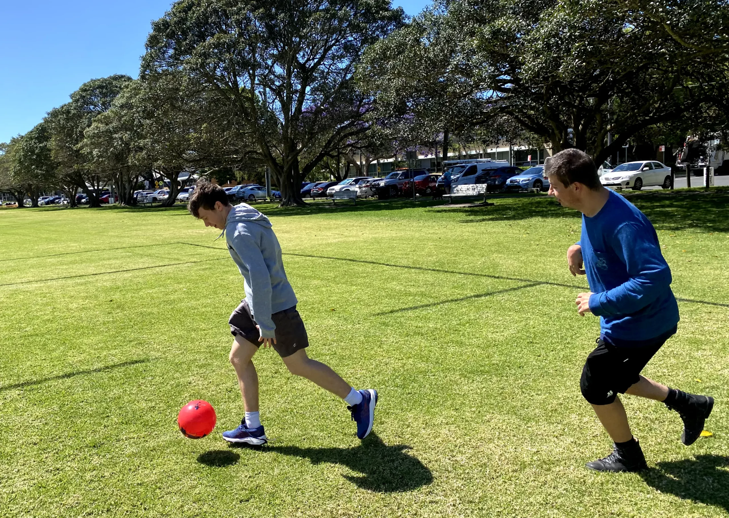 young adults playing ball together, practicing social skills at the eds change life skill program